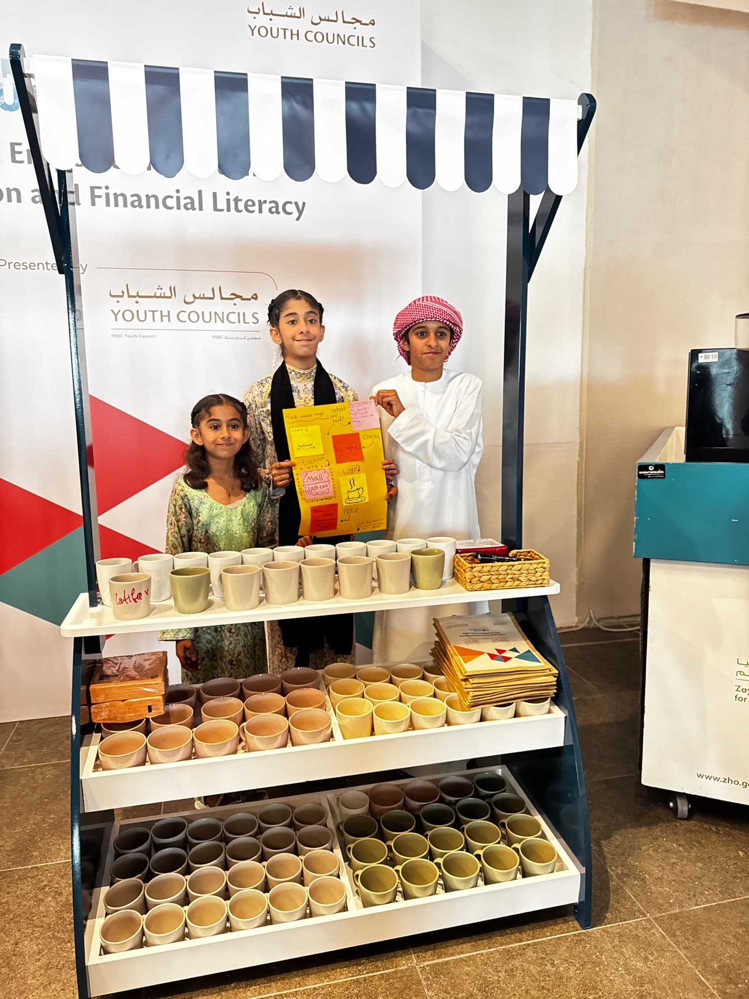 Children running a market stall at a financial literacy program